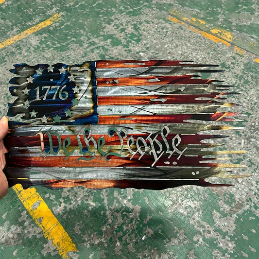 Distressed metal American flag wall art featuring 1776 and We The People text with patriotic red white and blue design